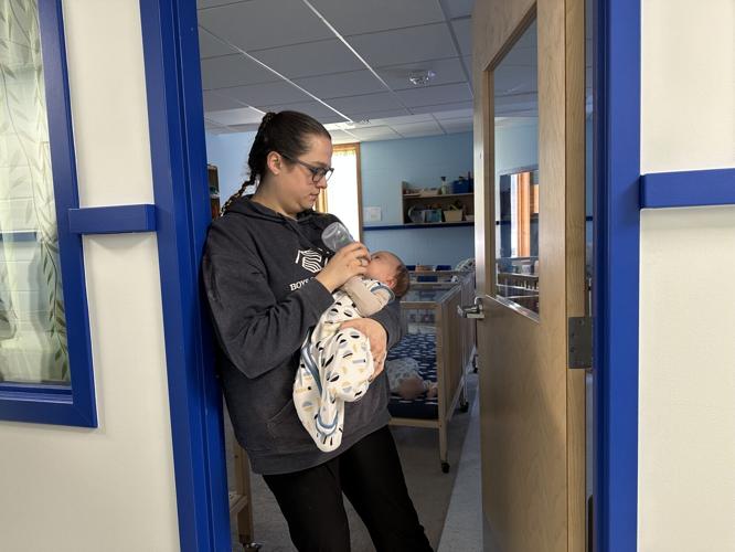 Infant is cared for at the White Mountains Learning Center