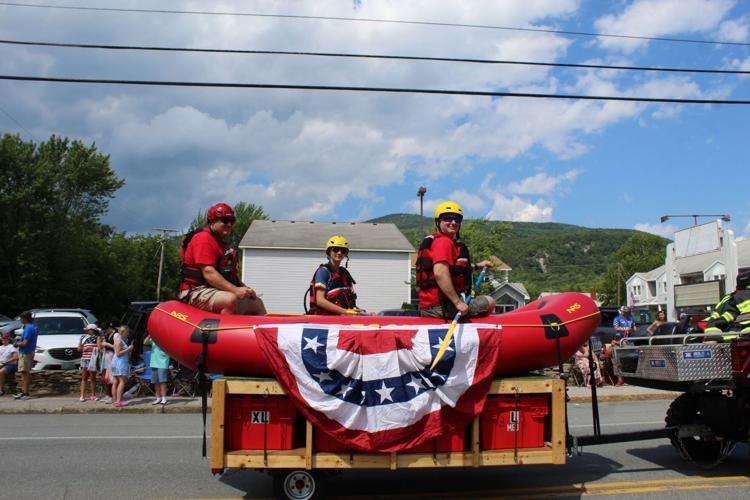 Rob Esty, Rhylan Cheshire and Shawn Costine man the swiftwater rescue boat