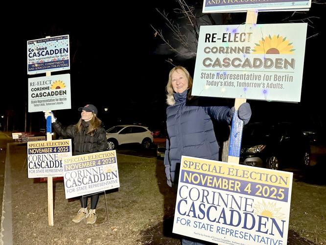 From left, a supporter held a sign Nov. 4 endorsing Corinne Cascadden