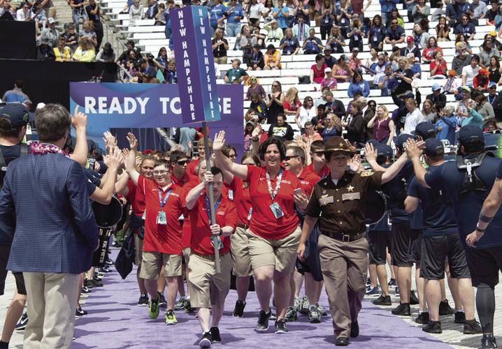 Kelley Jon carries the N.H. flag at the Opening Ceremonies