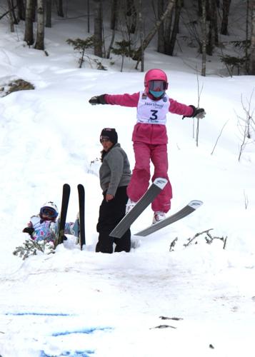 Hazel Klein takes flight during the K-10 ski jumping Eastern Invitational