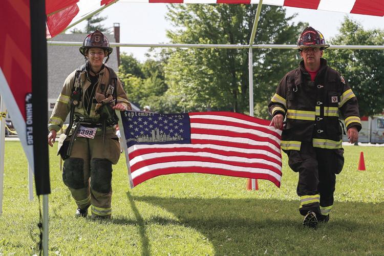 7-10-21 Tunnels to Towers firefighters flag at finish - Kerr and Locks