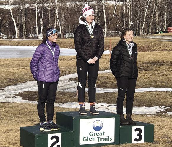 KHS Girls XC - State Champs - Carli Krebs and Grace Perley skate podium