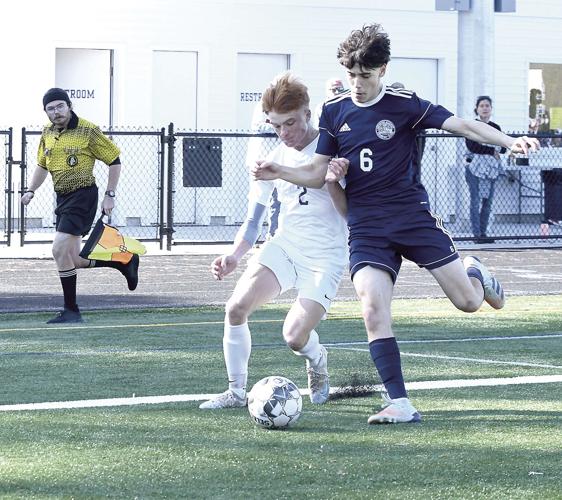 FA boys soccer - Gerry Daui tackle
