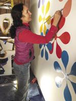 Local artist paints new public mural at Settlers Green