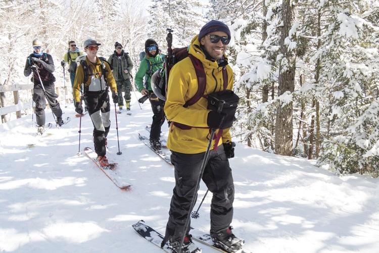 marika skiers up ravine trail