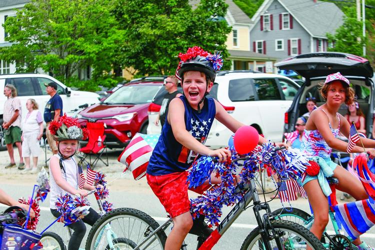 07-04-26 Fourth Parade Bartlett smiling bicyclists