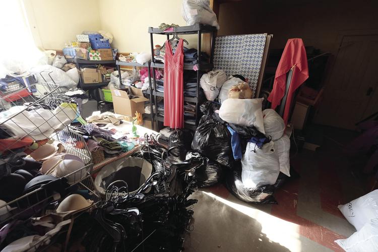 Revolving Closet back room piles of clothes