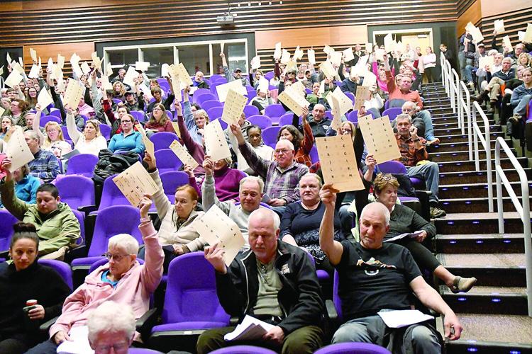 Conway School Deliberative Meeting - Voters raise their cards