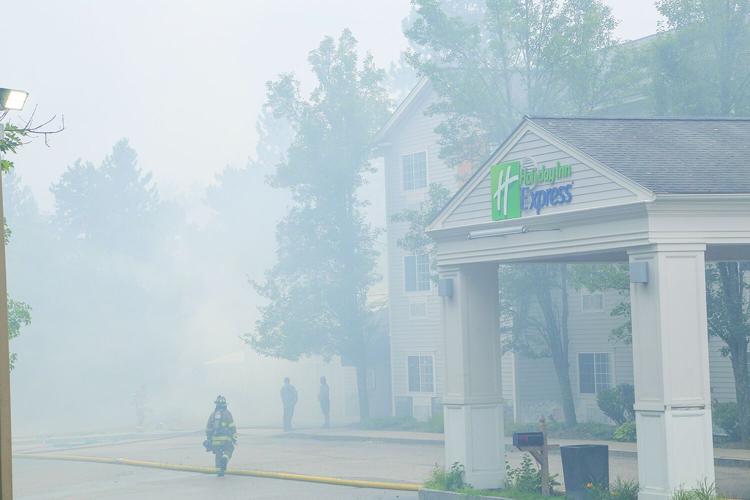 08-13-25 Holiday Inn-Brush Fire smoky firefighters walking