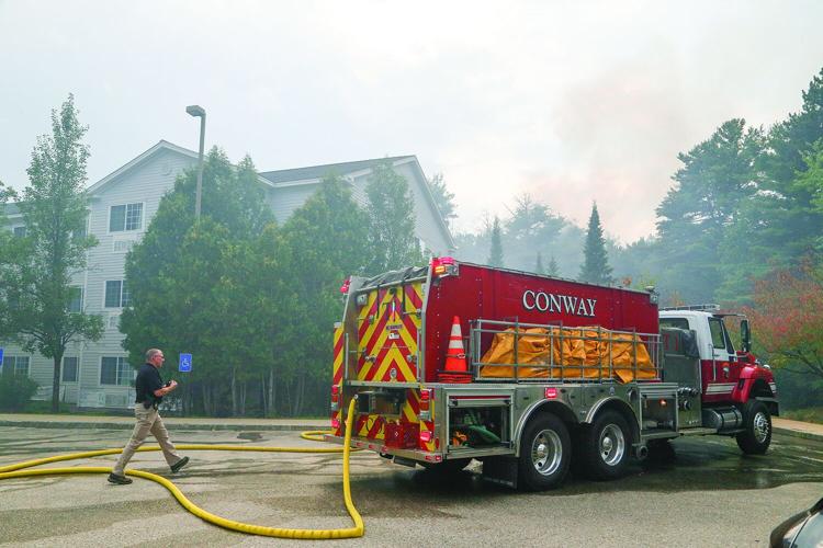 08-13-25 Holiday Inn-Brush Fire smoke behind conway truck