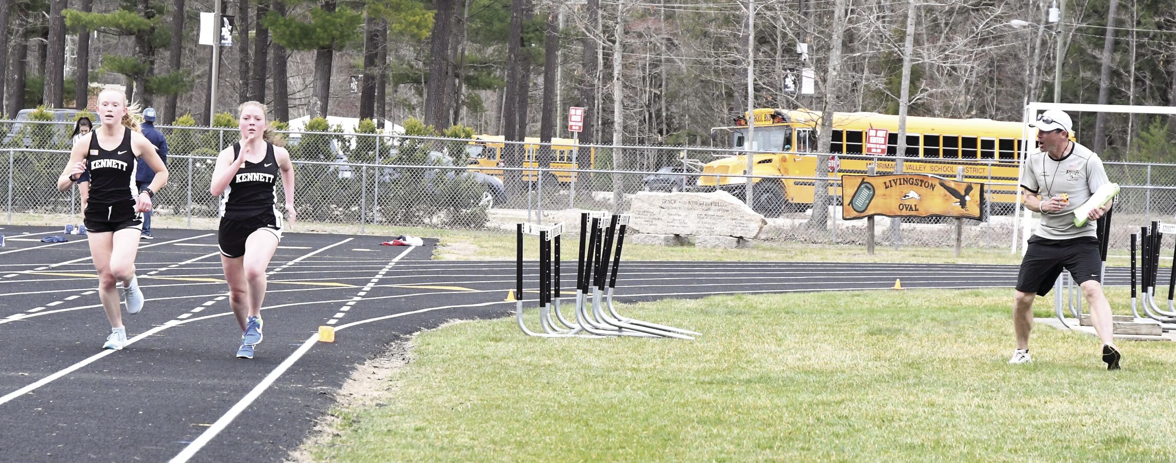 KHS Track - 1600 meters - Coach Tim Livingston with Grace Perley and Maya Gove