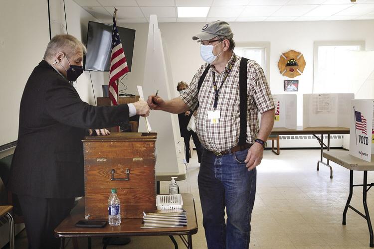 05-11-21 Bartlett voting handing in ballot