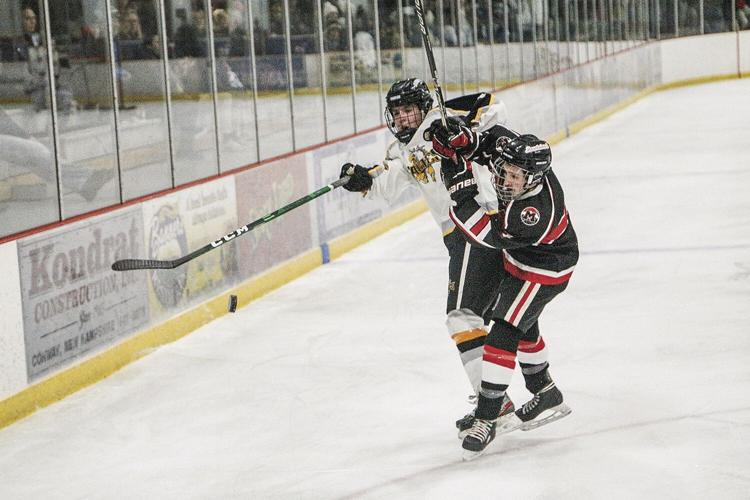 12-14-22 KHS-Berlin Hockey croteau-murphy colliding by puck 2