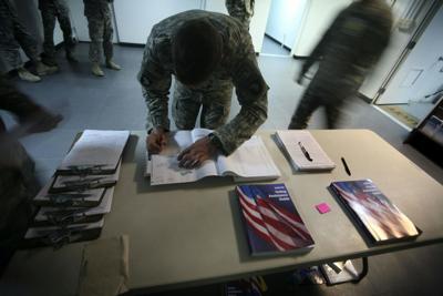 A service member fills out an absentee ballot in Afghanistan in 2008. Overseas voters often rely on mail-in ballots.