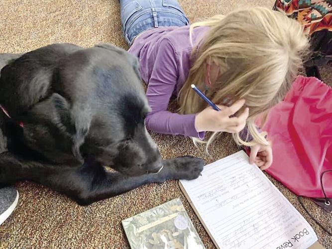 ACTS - Flora with student doign homework