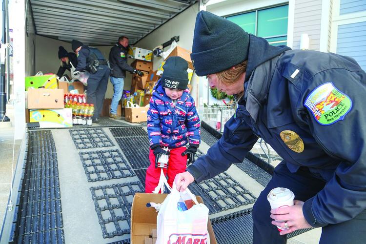 12-06-25 Conway PD Food Drive mom and son horizontal