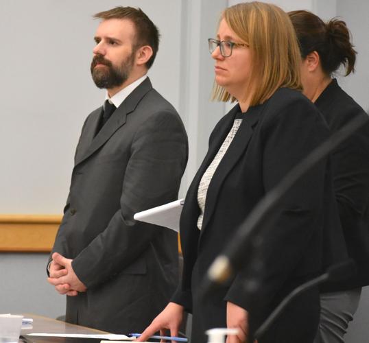 Dustin Duren stands at left as he hears Coos County Judge Jonathan Frizzell sentence him