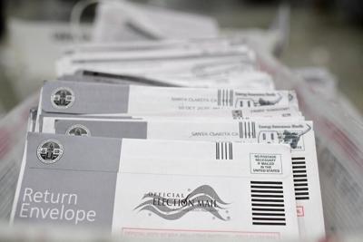 Mail-in ballots in their envelopes await processing at the Los Angeles County Registrar-Recorder's mail-in ballot processing center in Pomona, Calif., on Oct. 28, 2020.