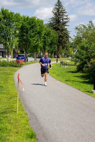 A lone runner makes his way along the course at the Aug. 9 inaugural Strive 5K