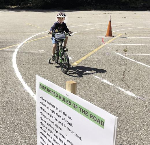 Wheel Family Fun - youngster at Kids’ Bike Safety Day’s Bike Rodeo Course at Story Land