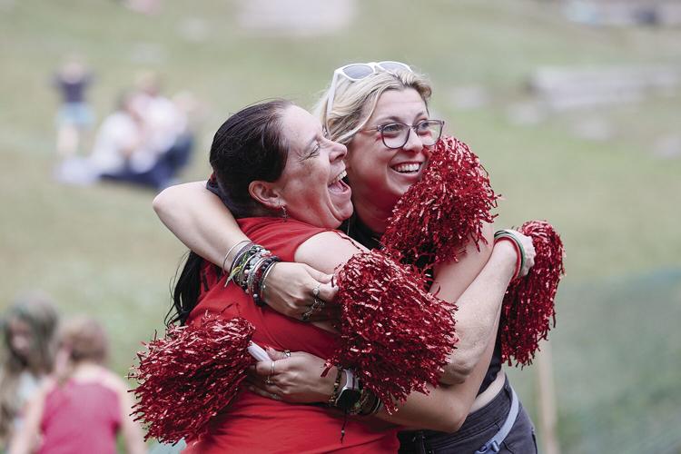 09-10-23 MudBowl Semis fans hug