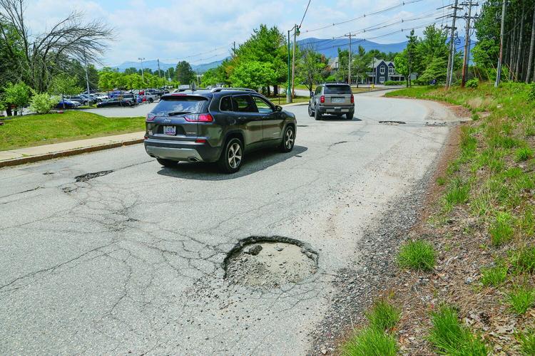 06-11-25 Potholes two cars