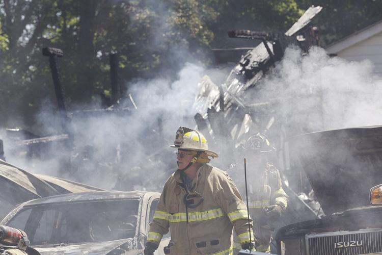 08-03-22 Greenwood Fire walking away from building