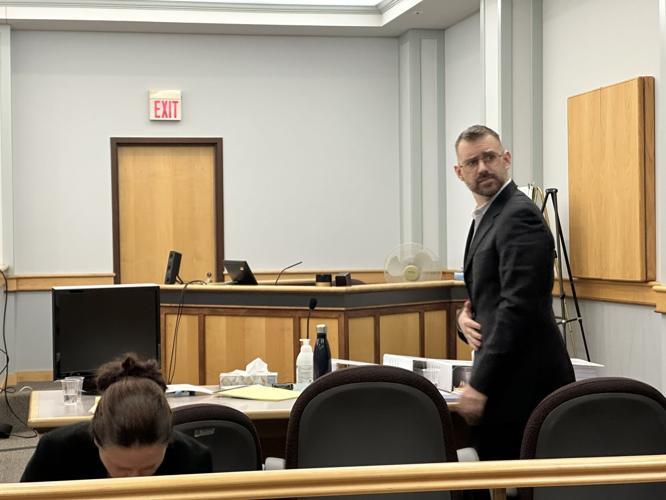 Defendant Dustin Duren looks out into the courtroom at the start of his murder trial