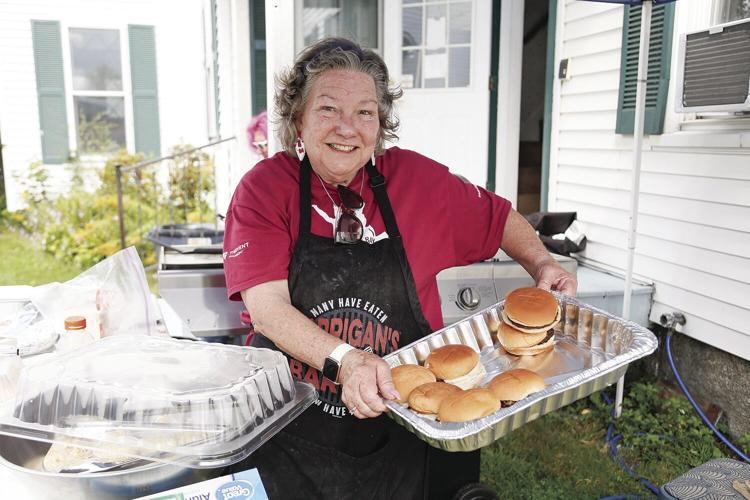 08-22-24 Resource Fair volunteer with burgers