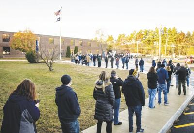 Merrimack voters que up
