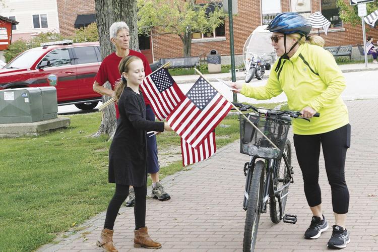 09-11-22 9-11 Ceremony handing flag
