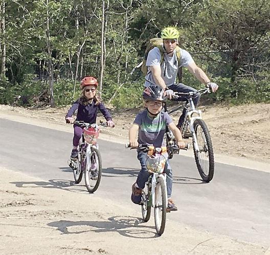 Wheel Family Fun - father and his young kids on MWV Rec Path