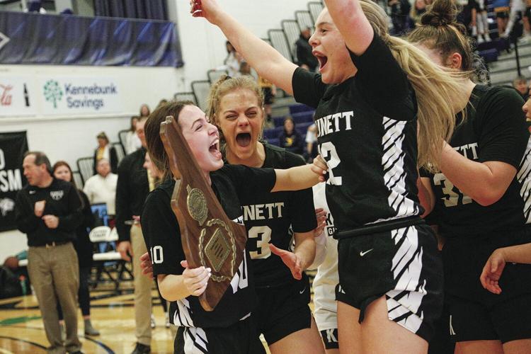 03-12-23 KHS WBB cheer with trophy tighter