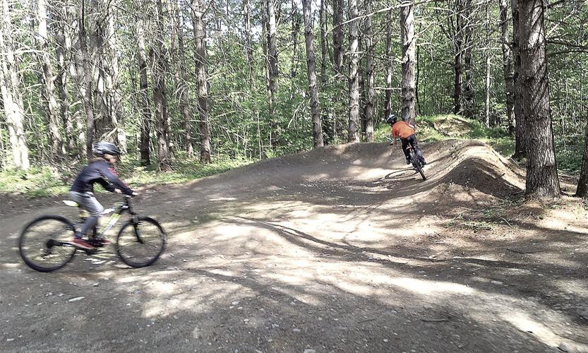 Wheel Family Fun - riders ride the pump tracks berms and bumps
