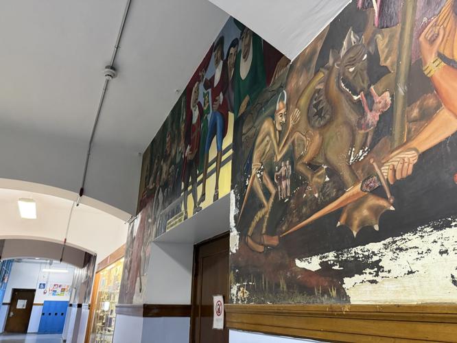 One of the mural panels inside the former Berlin High School