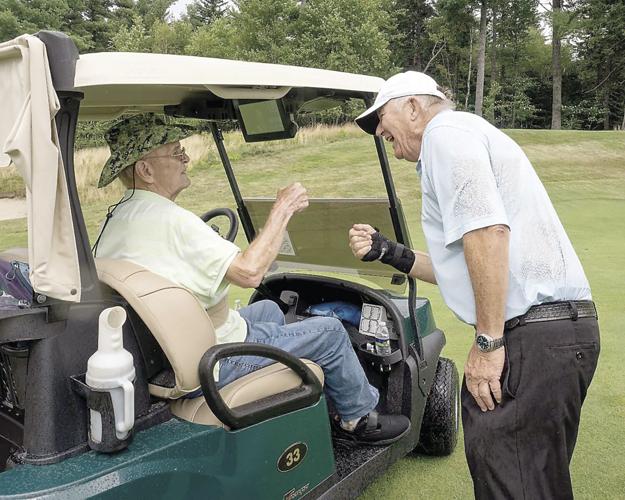 The Golf Column - Hales Location - Kim O'Neil PGA HOPE wih Navy veteran