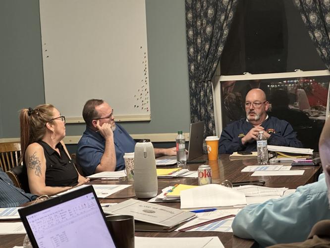 Berlin Fire Chief James Watkins (center) spoke frankly of the impact of budget cuts