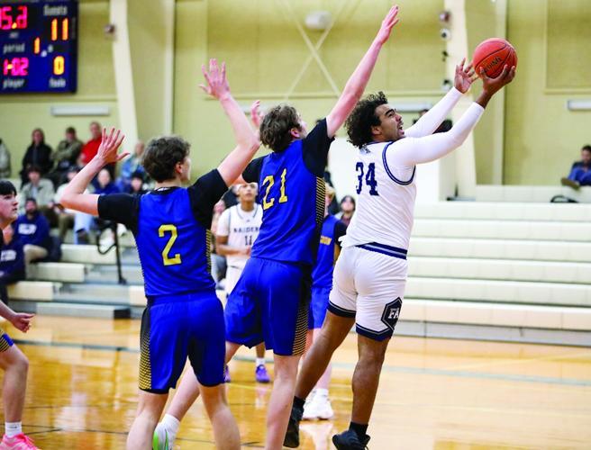 FA Boys Hoop. - Gian Uribe shooting