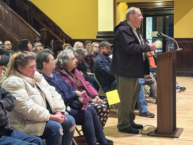 Dennis Murphy stands to speak about encouraging retail traffic on Main Street