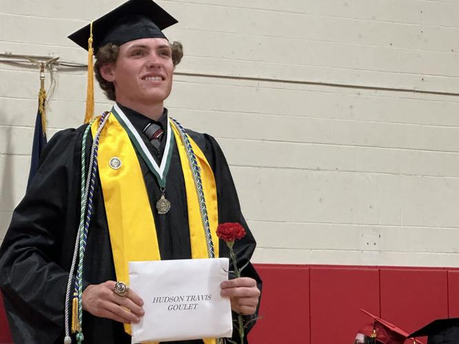 Hudson T. Goulet holds his diploma at the June 5 graduation