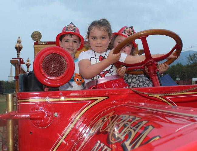 Taking a turn driving the 1916 Federal fire truck during the Aug. 5 National Night Out