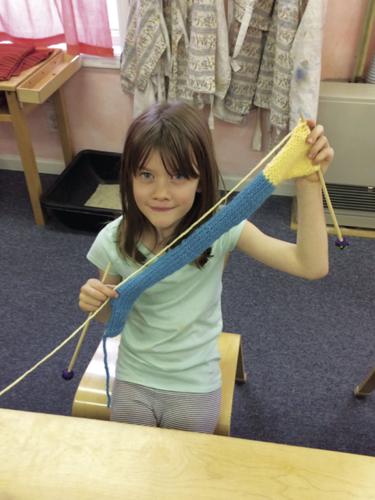 child knitting