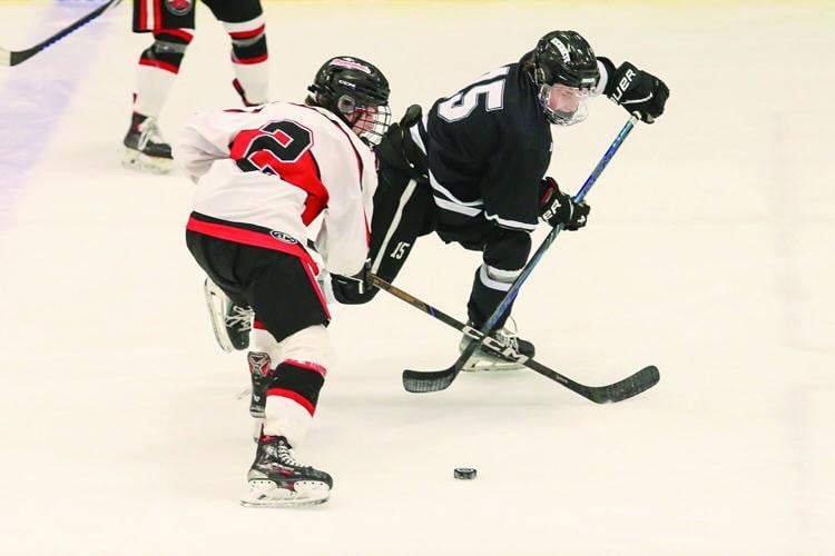 03-11-26 KHS-BG Frozen Four parsons warner crossed