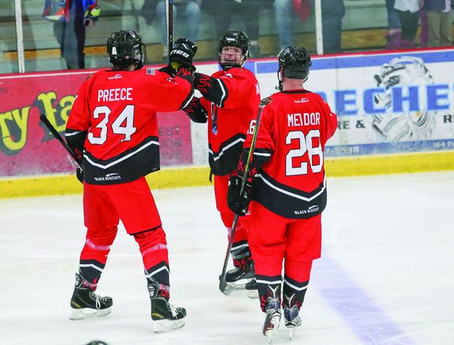 03-23-26 Battle Badges Hockey goal fist bumps 1