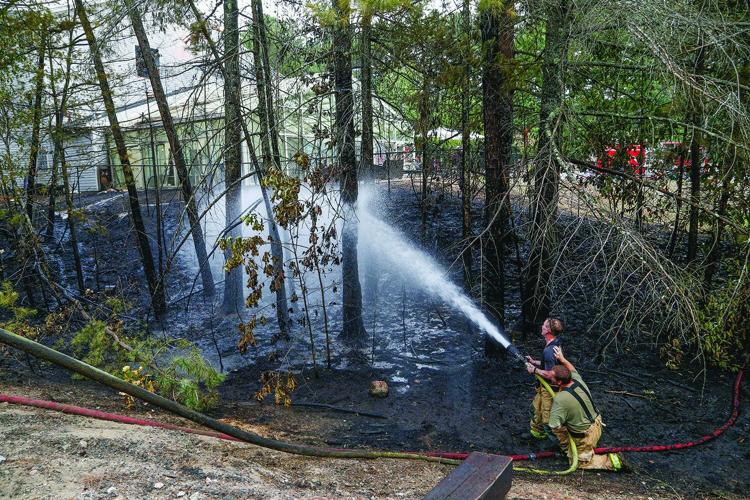 08-13-25 Holiday Inn-Brush Fire hosing behind hotel 1