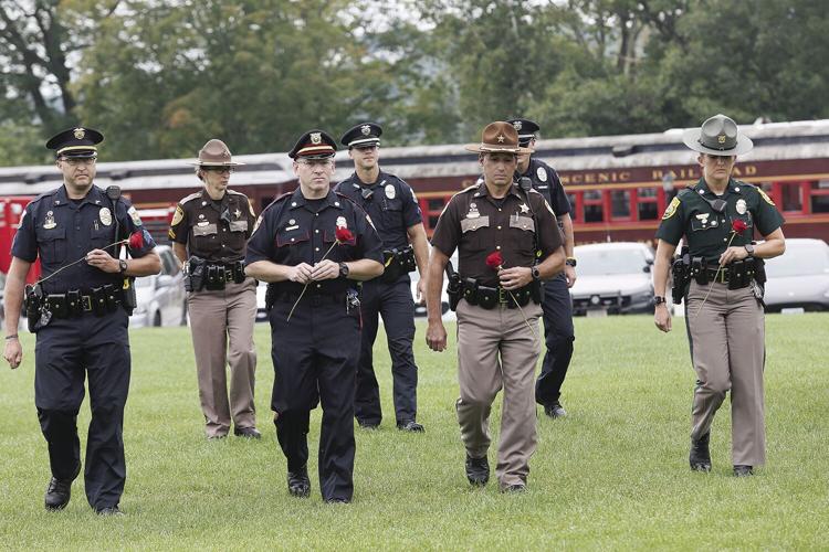 09-11-22 9-11 Ceremony law enforcement roses