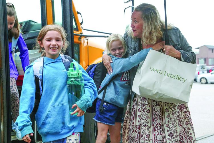 09-03-26 First Day School CIS hug smiles