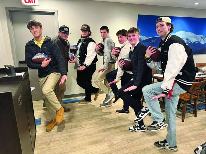 KHS Football - banquet - Heisman Trophy poses