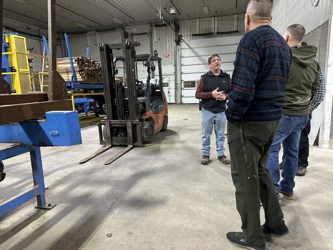 Steve Halle, operations manager at Milan Lumber, Rep. Marc Tremblay, Robert Cone